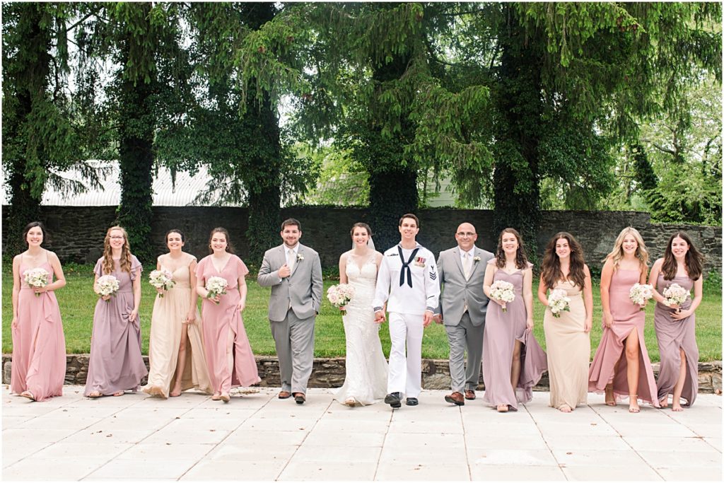 All of the wedding party assembled in a line for a photo. Wedding photography in Maryland done by Ashley.