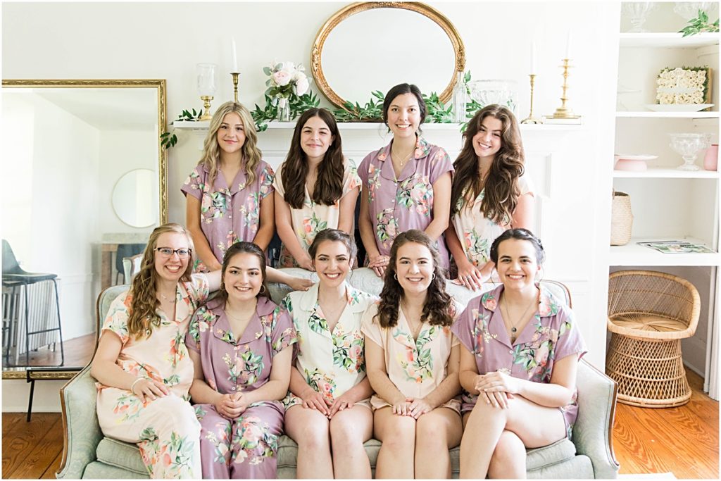 The bridesmaids all assembled together on a couch before getting ready. Wedding photography in Maryland done by Ashley.