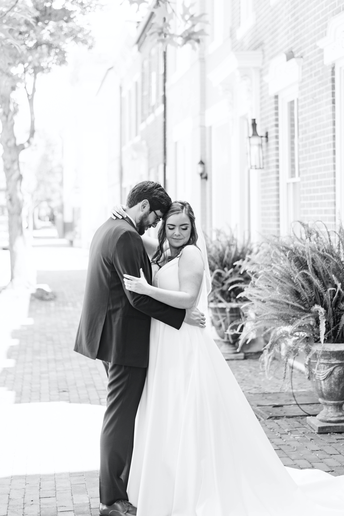 Jessica and Seamus embracing as bride and groom, wedding photography done in Alexandria Virginia