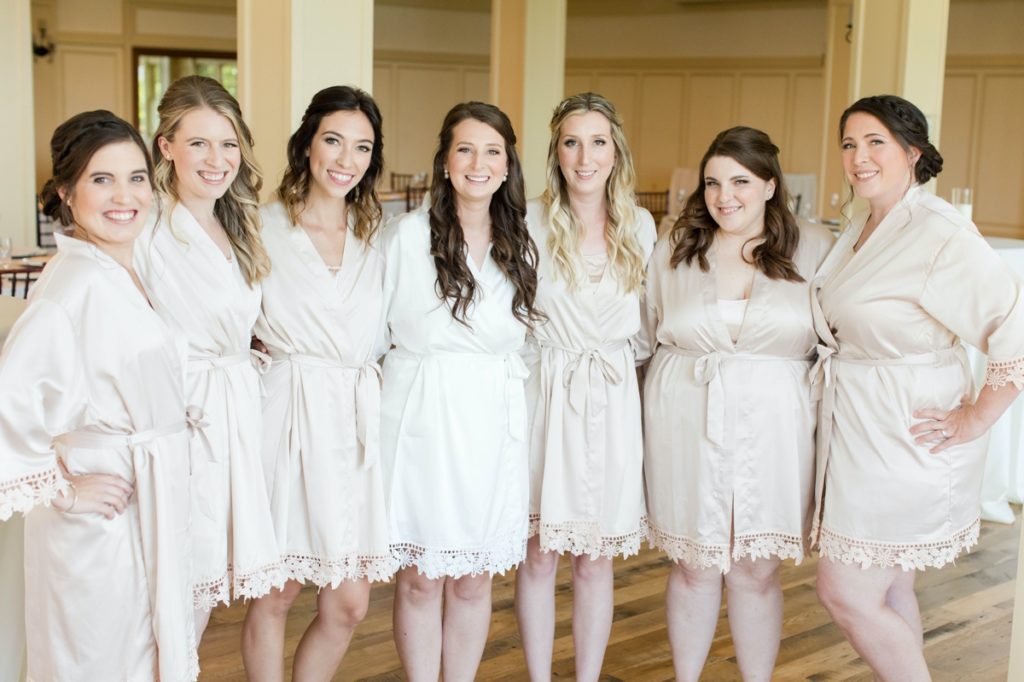 Katie and her bridesmaids in pink satin robes before the Cotoctin Hall Wedding at the Musket Ridge Golf Club in Maryland