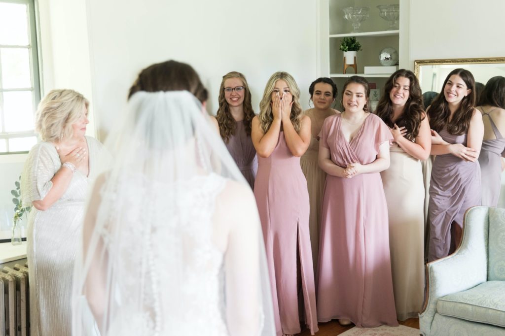 First look with the excited bridesmaids.