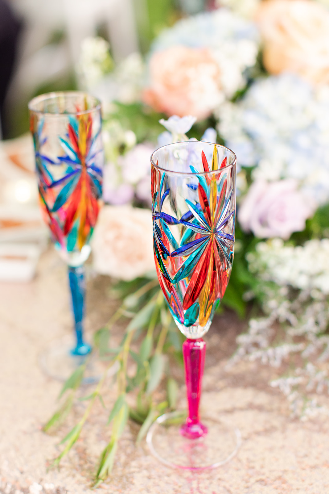 colorful champagne flutes used at a summer wedding