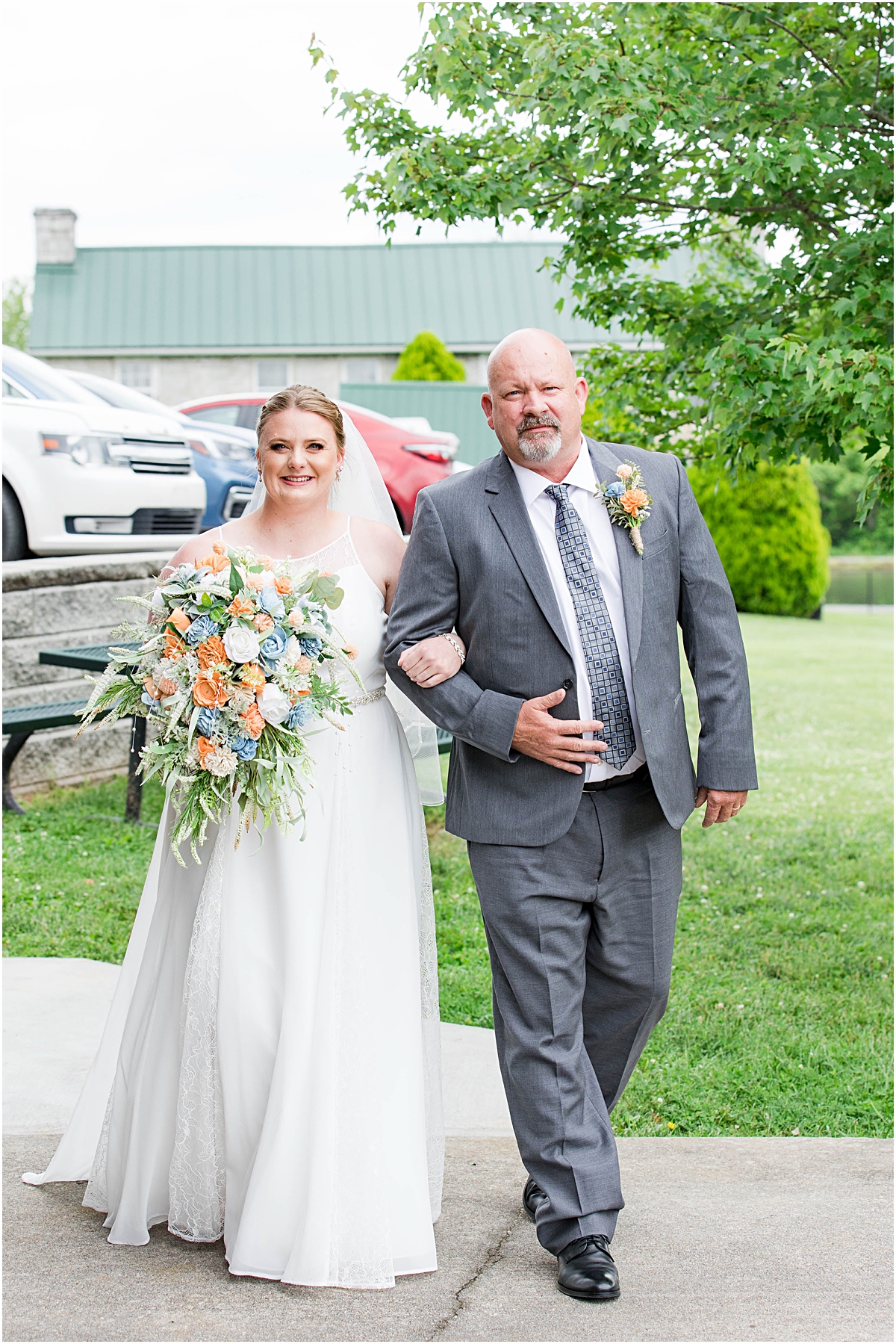 Anneliese and her dad waiting to walk down the aisle on her wedding day at Poor Farm House Park.