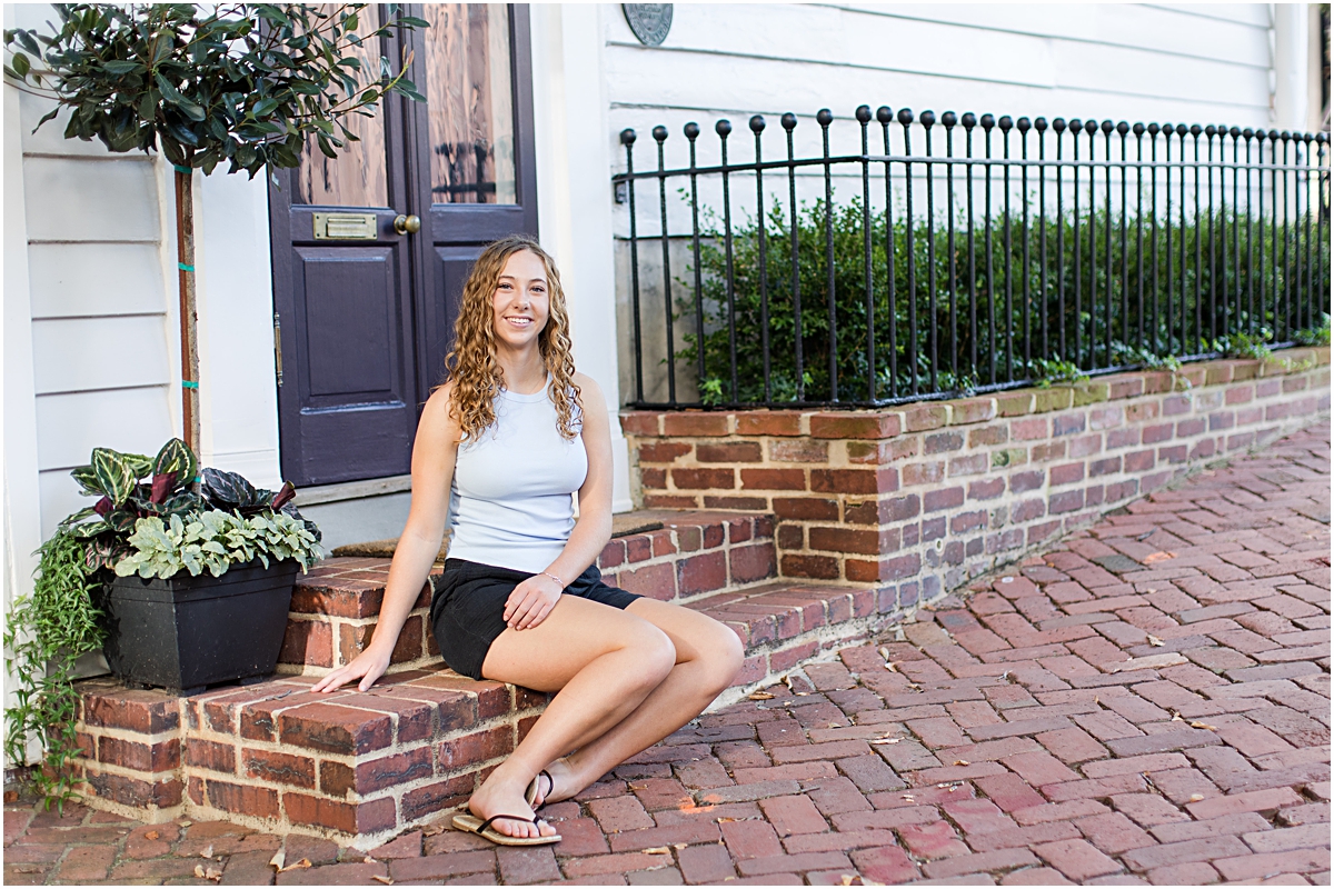 Amanda posing on brick steps downtown in Alexandria VA; photo taken by a photographer in Virginia.